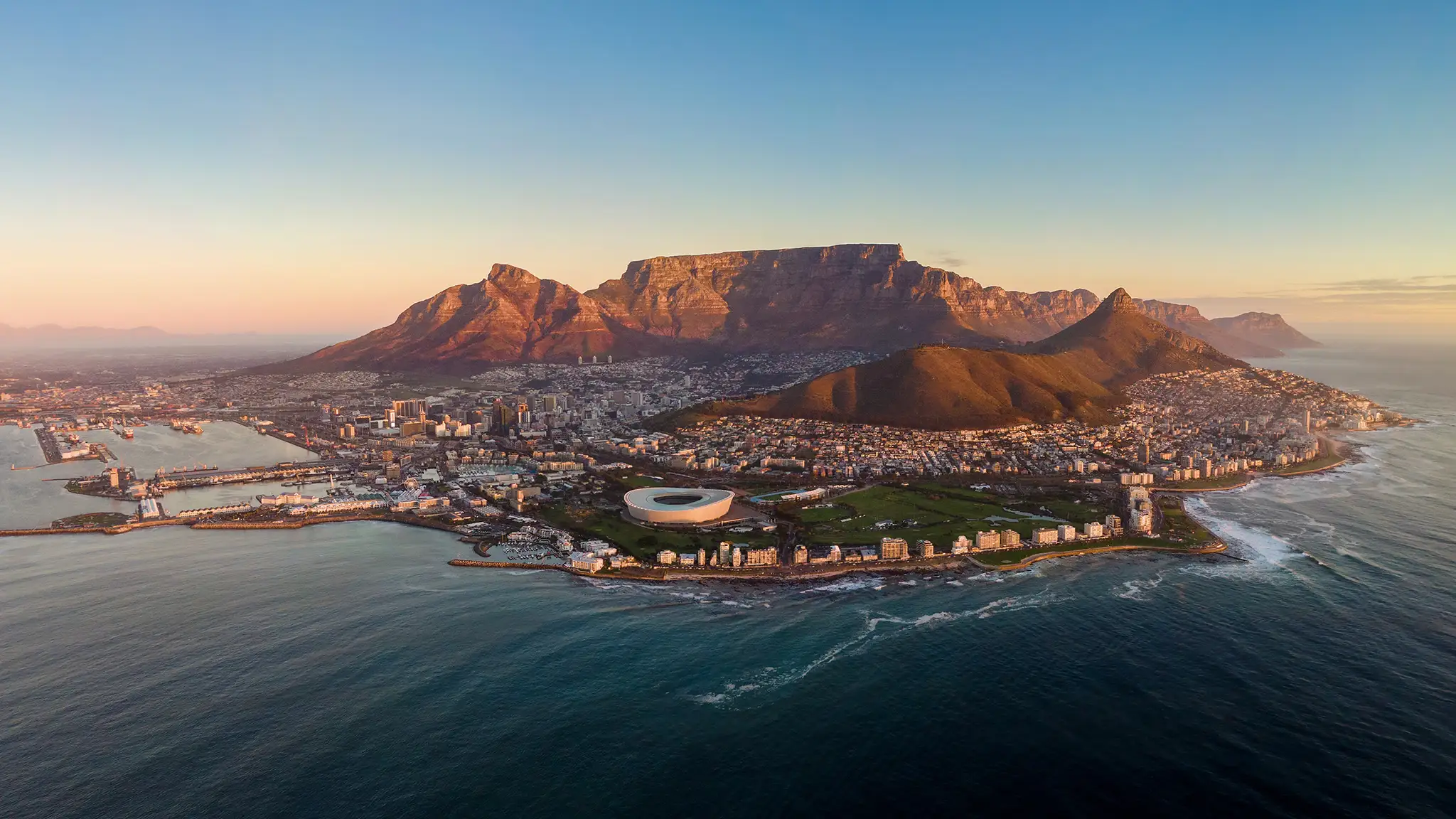 Aerial panoramic view of Cape Town cityscape at sunset, Western Cape Province, South Africa.