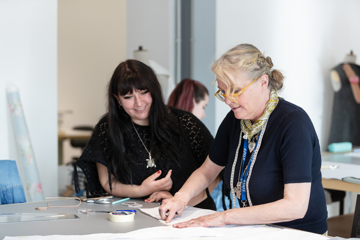 Two students taking part in an art and design session