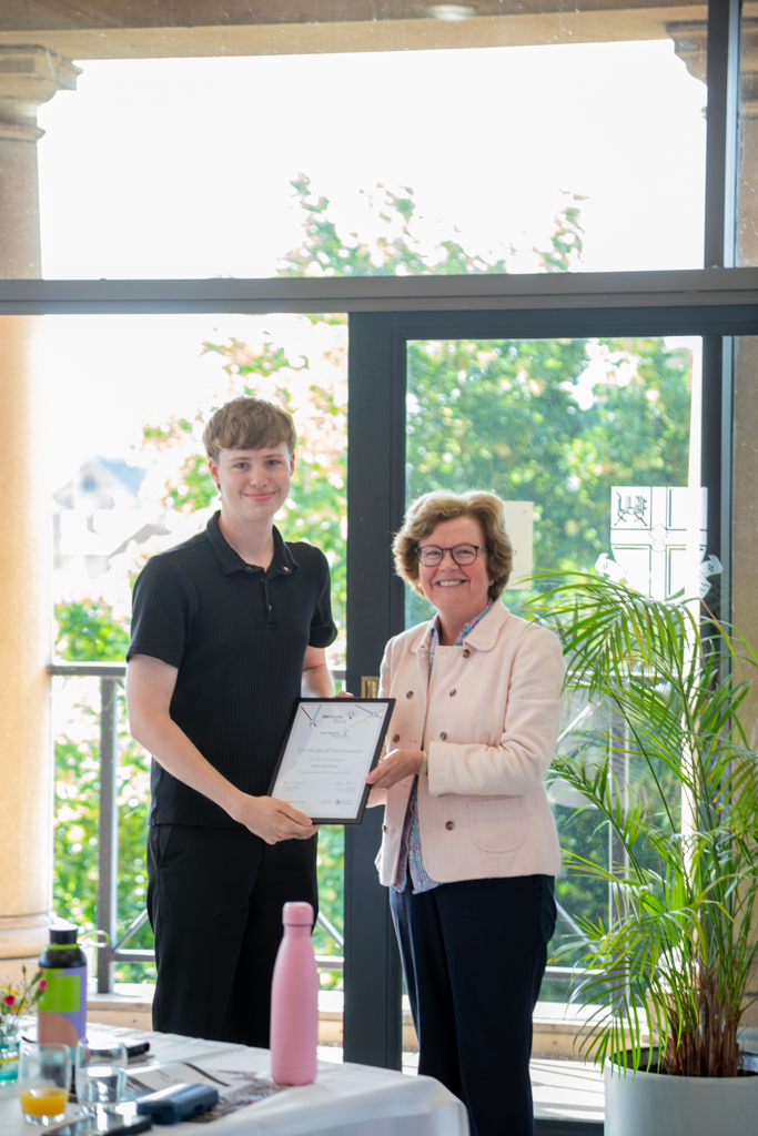 MALE STUDENT RECEIVING AWARD