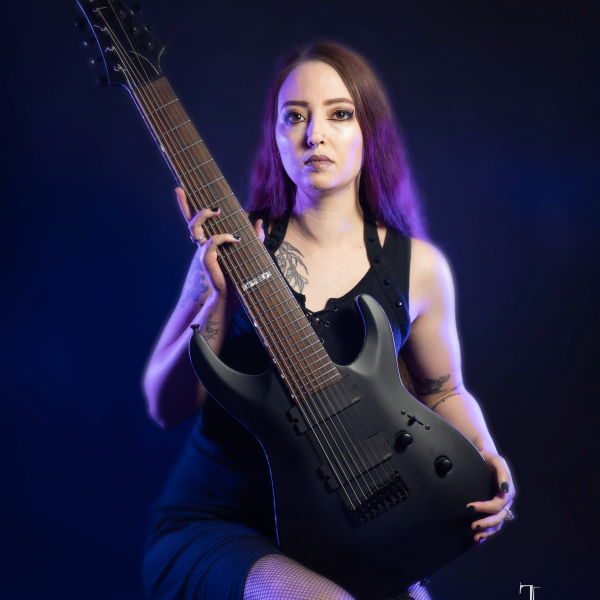 woman holding a guitar