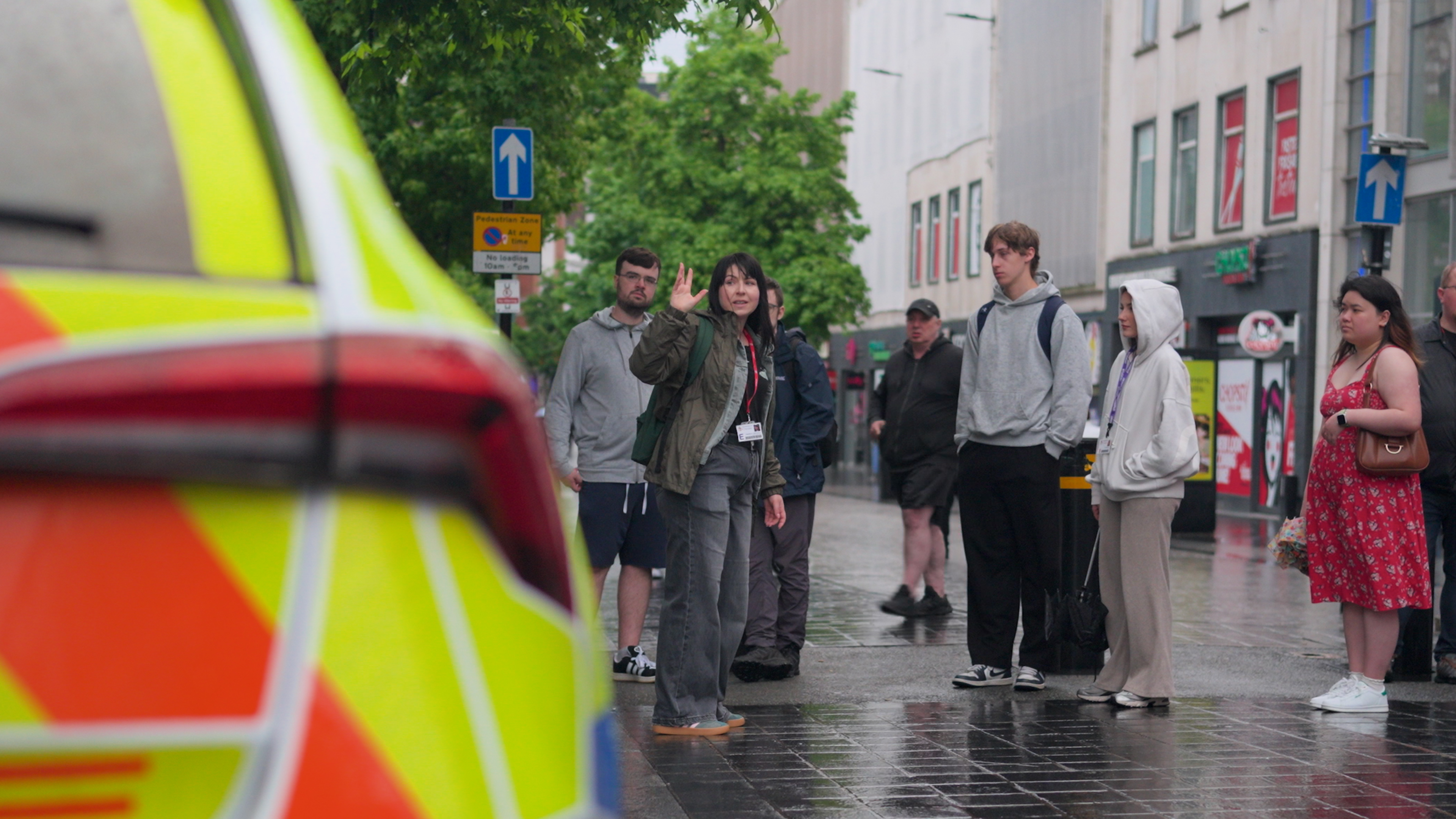 kim ross talking with students on a walking lecture tour in liverpool