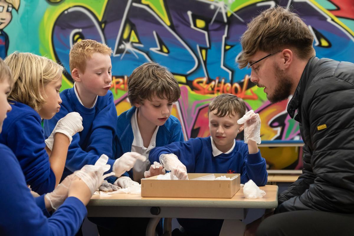 Early Childhood and Primary Education BA student leading a practical learning session with primary school pupils.