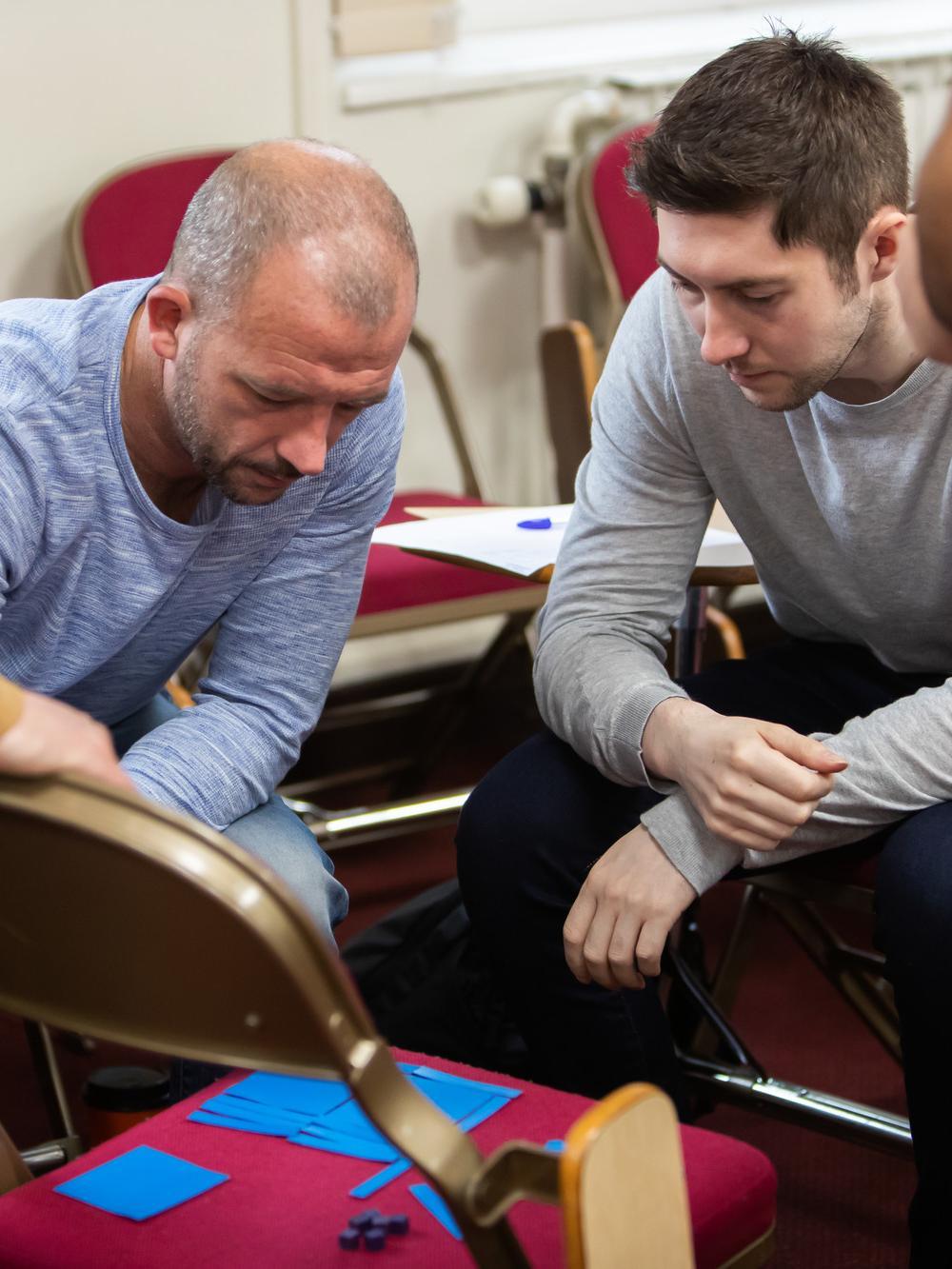 Two trainee teachers taking part in a learning activity.