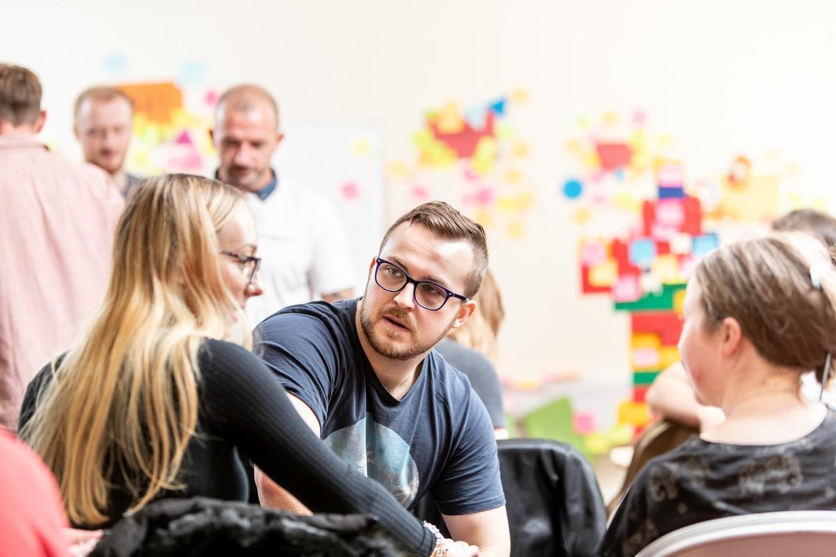 Postgraduate students collaborating in a classroom discussion at the University of Chester. Study the Education MA to explore contemporary educational practice, research, leadership and learning in diverse educational settings.