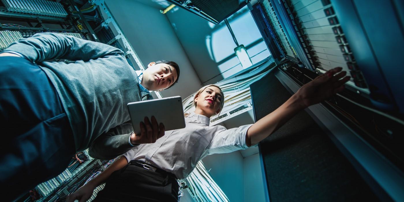 Engineering Management MSc students working with server infrastructure and digital systems, developing leadership, project management, and engineering decision-making skills in a high-tech environment.