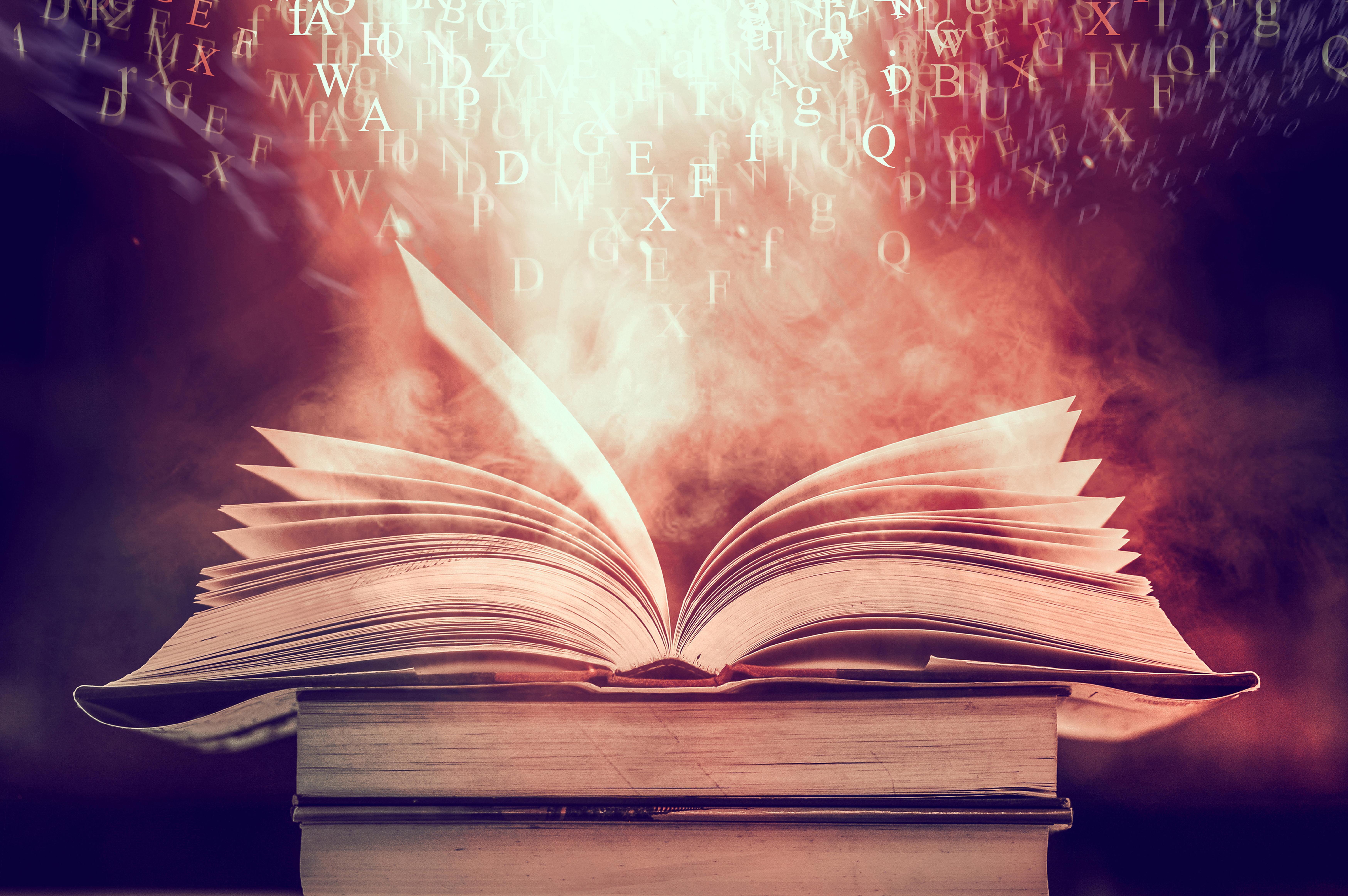 Magical open book with letters in the air, symbolising literature, creativity, and English degree study.