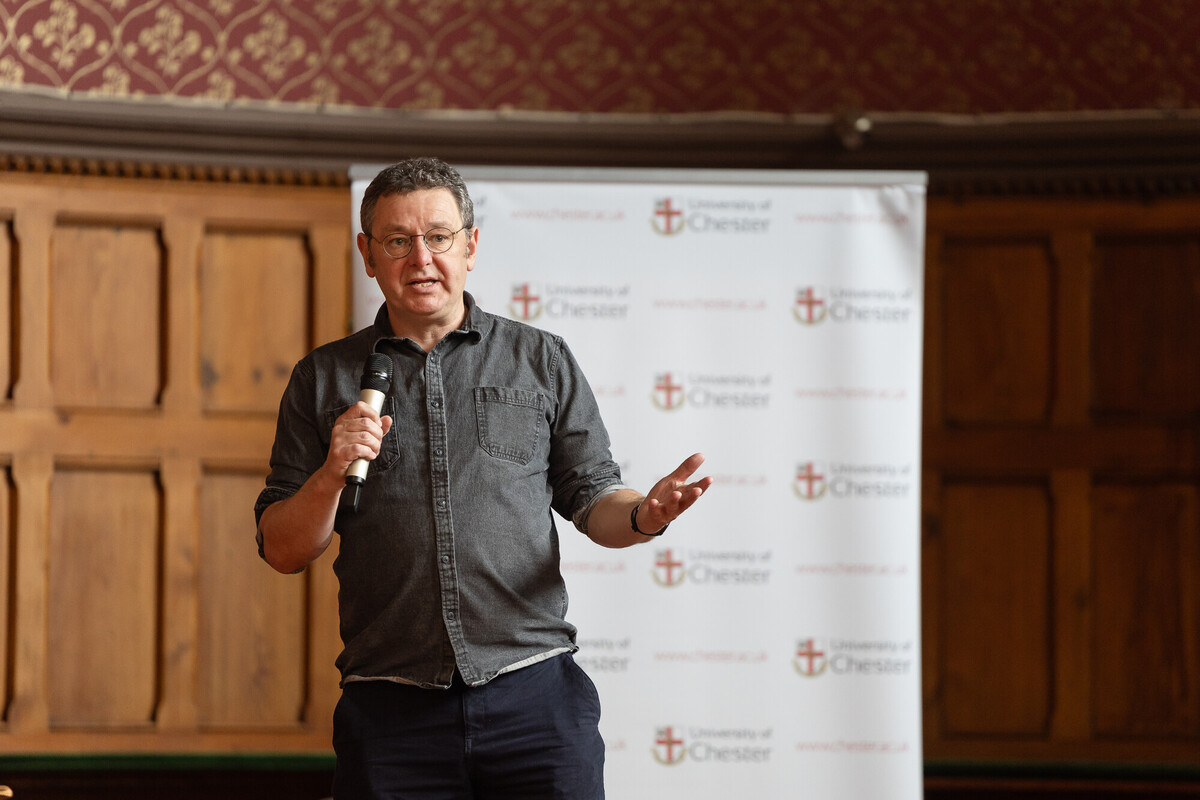 howard williams speaking with a microphone
