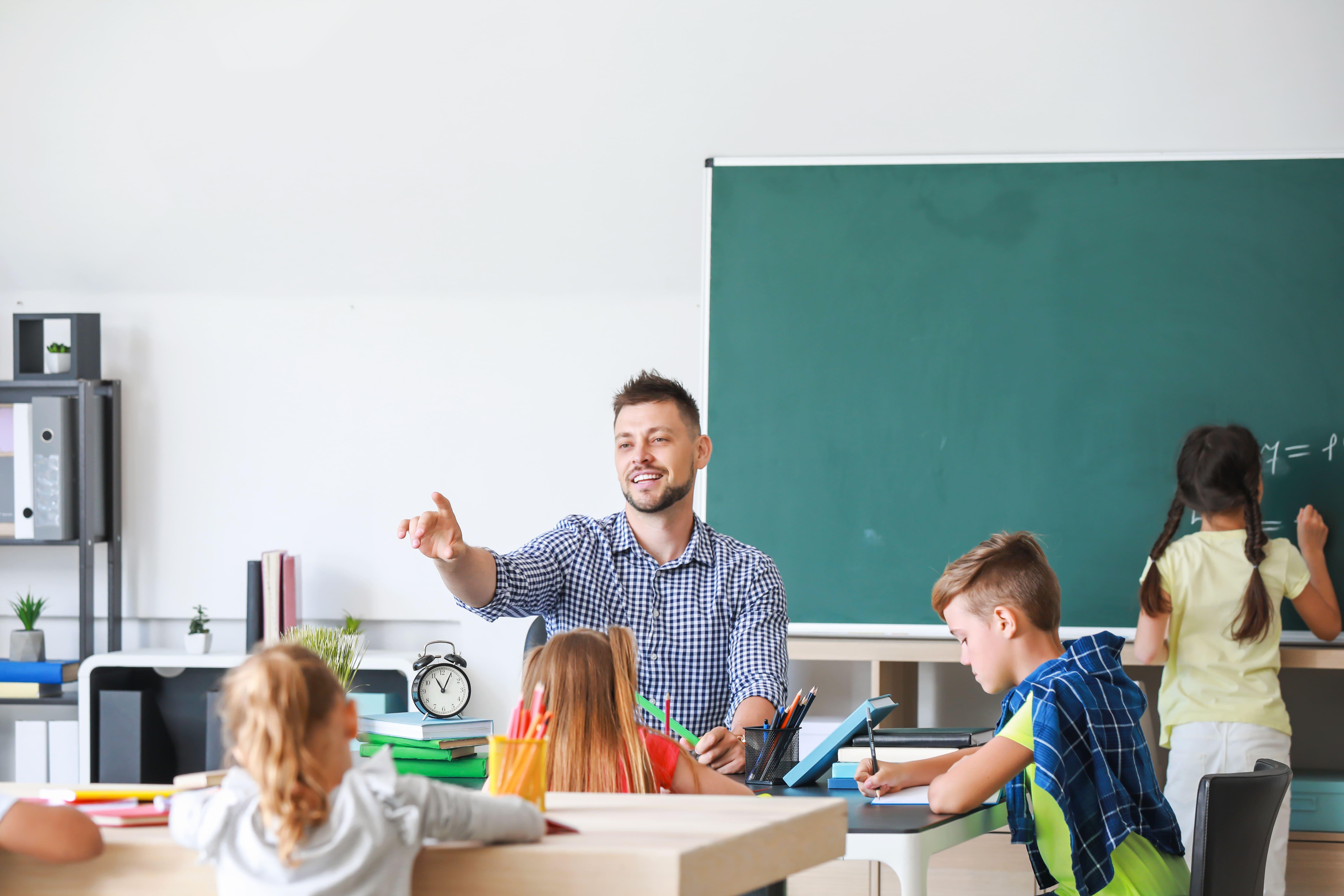 Primary (5-11) PGCE trainee teacher leading a classroom lesson with primary school pupils, developing teaching, learning and classroom management skills at the University of Chester.