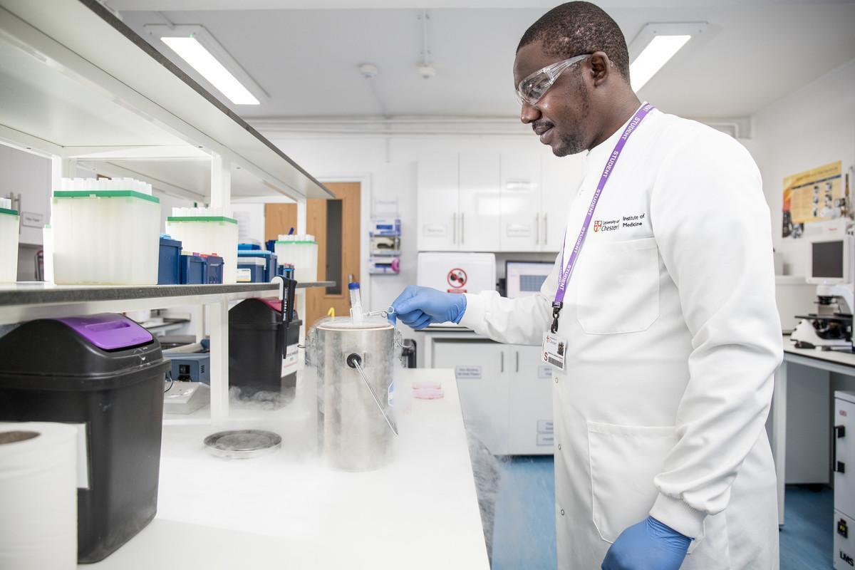 Research student working in a biomedical laboratory, representing the Medical Science MRes course at the University of Chester.