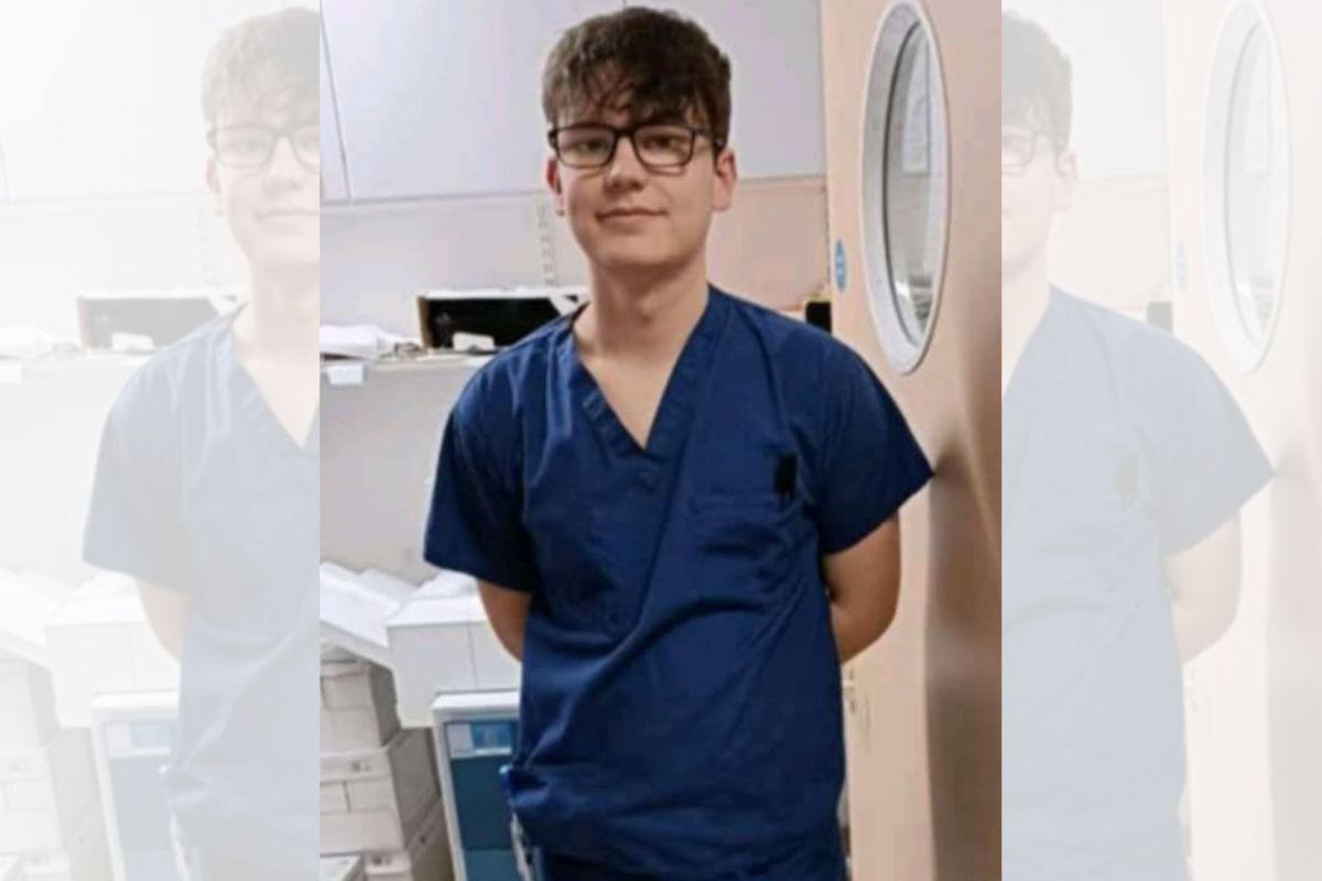 A picture of Charlie Sinclair in nursing outfit, looking at the camera.