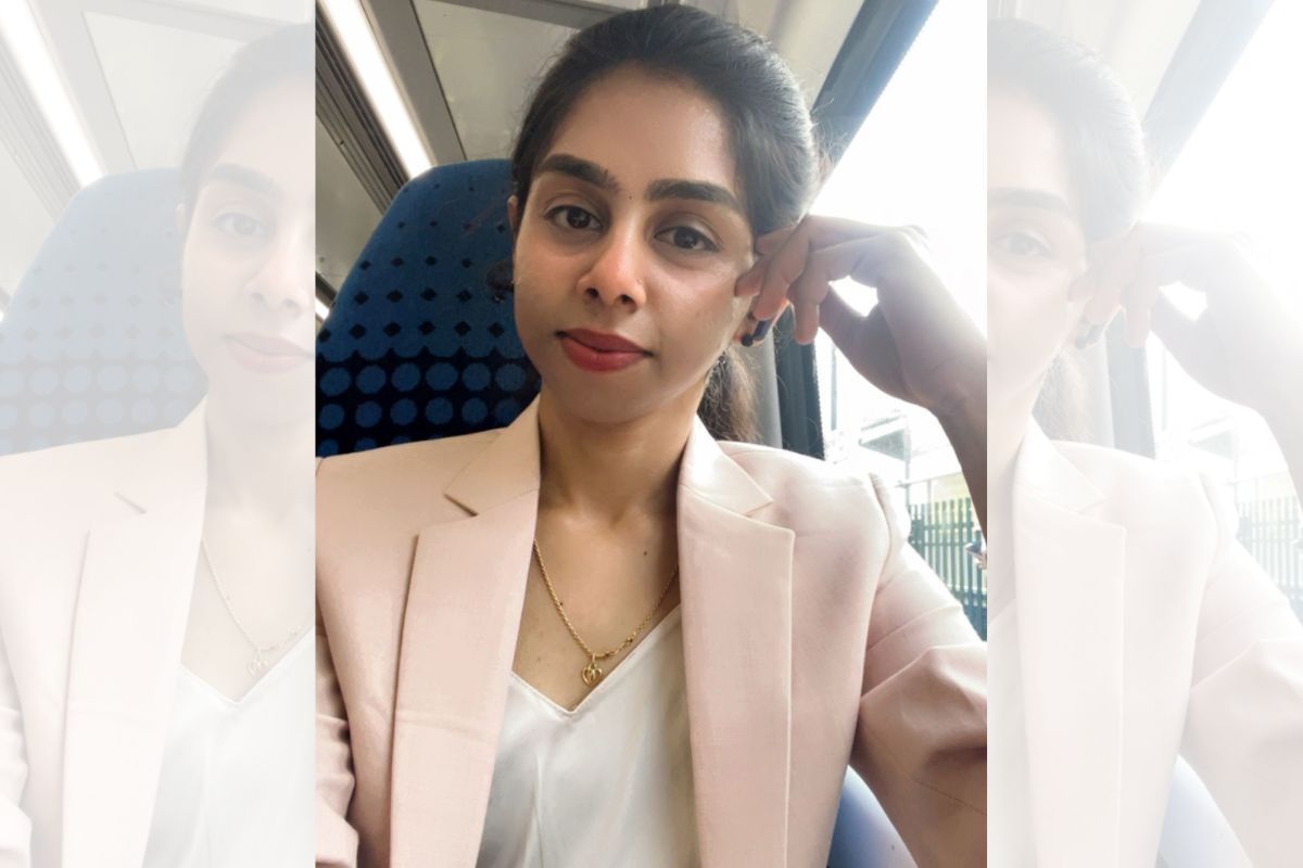 A portrait photo of Nivetha looking at the camera, while seated.