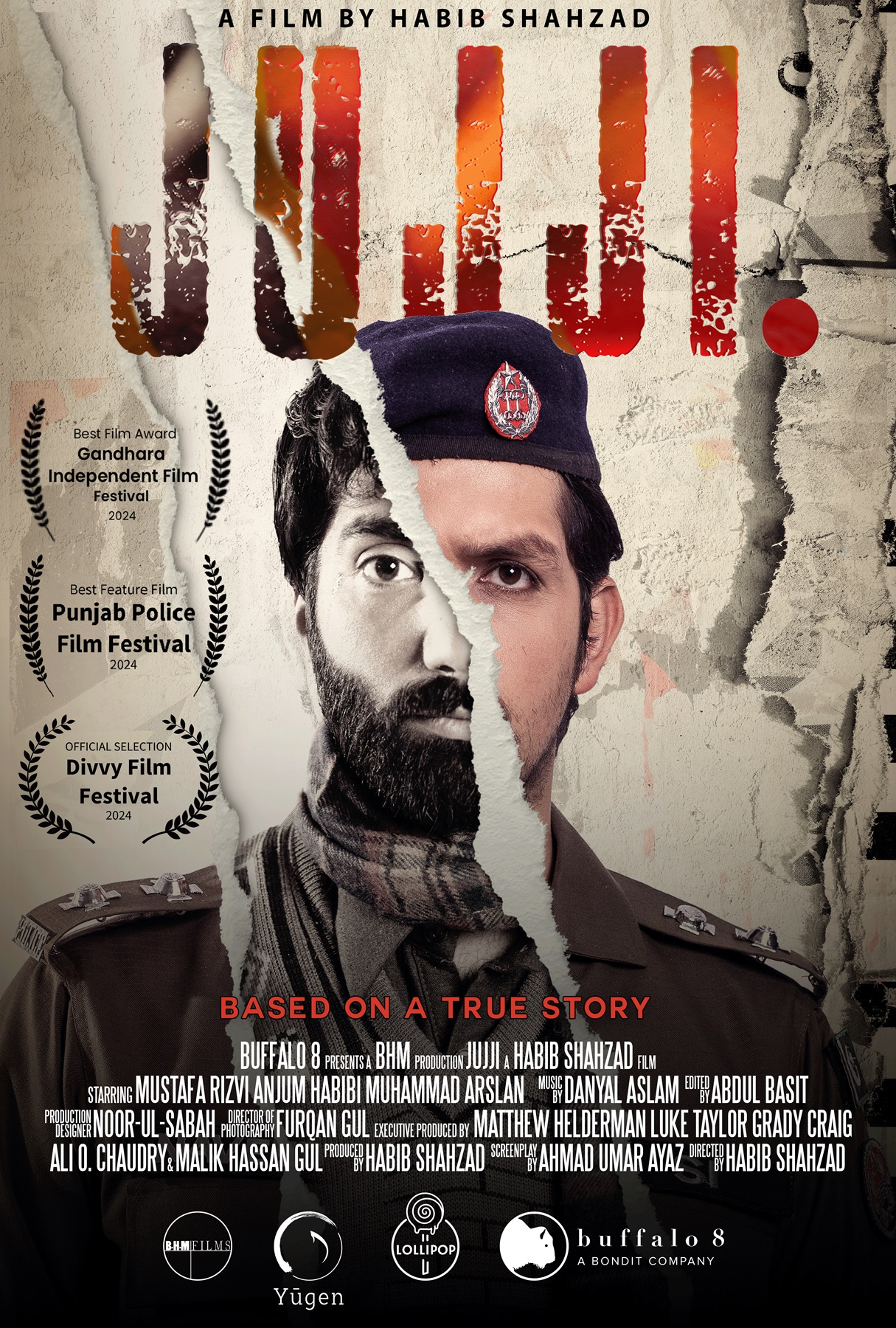The promotional poster for the film Jujji, which has the portraits of two men diagonally split across the face.