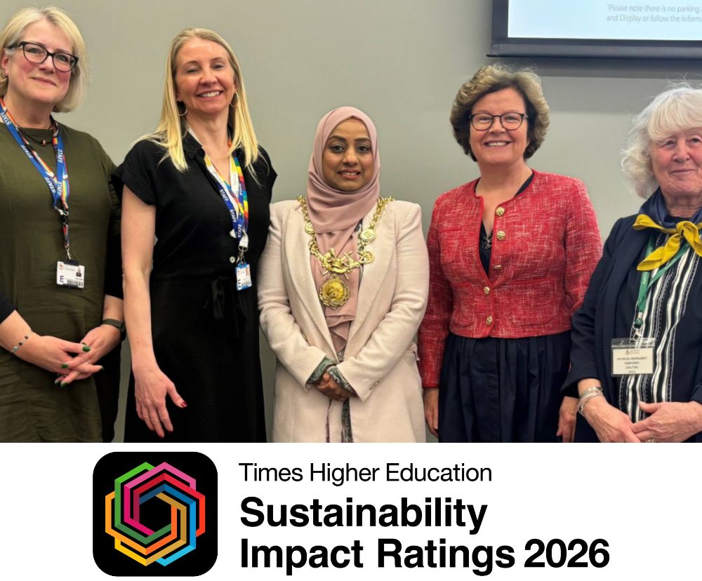 Five women looking at the camera, smiling. Underneath the photo is the logo for the Sustainability Impact Rankings 2026.