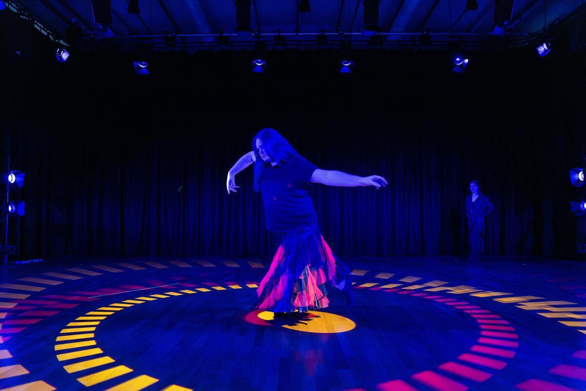 BA (Hons) Drama degree course student showcasing a stage performance with creative lighting during a university theatre production.