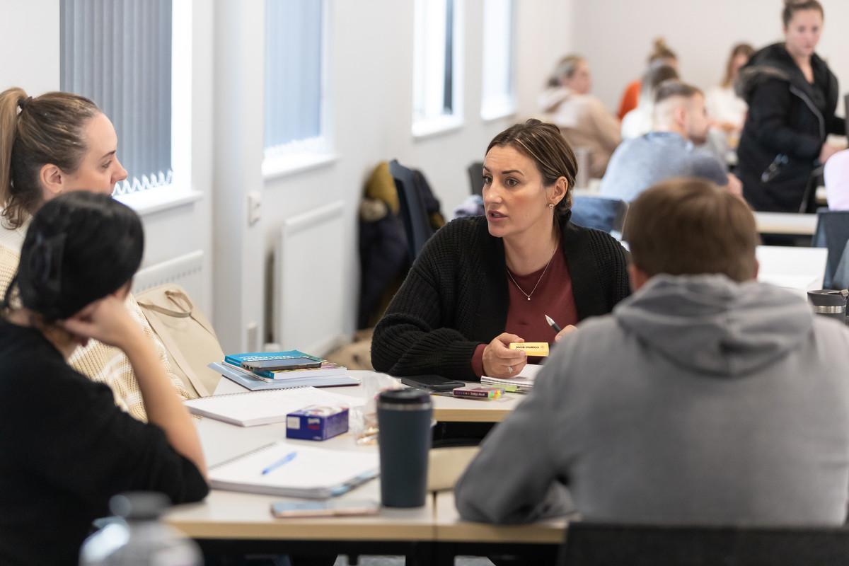University students engaged in discussion and collaborative study, exploring key themes in global affairs, politics, and international relations with history BSc Hons degree.