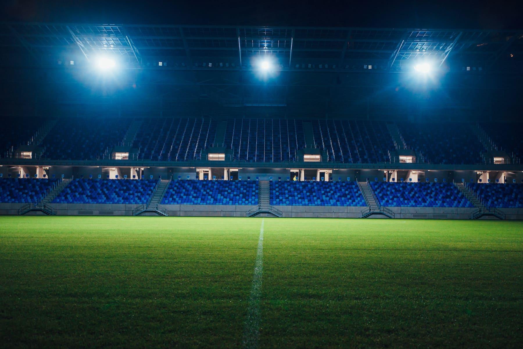 Empty football stadium at night with vibrant lighting, symbolising professional venues studied in Sport Business Management BA (Hons) at the University of Chester.