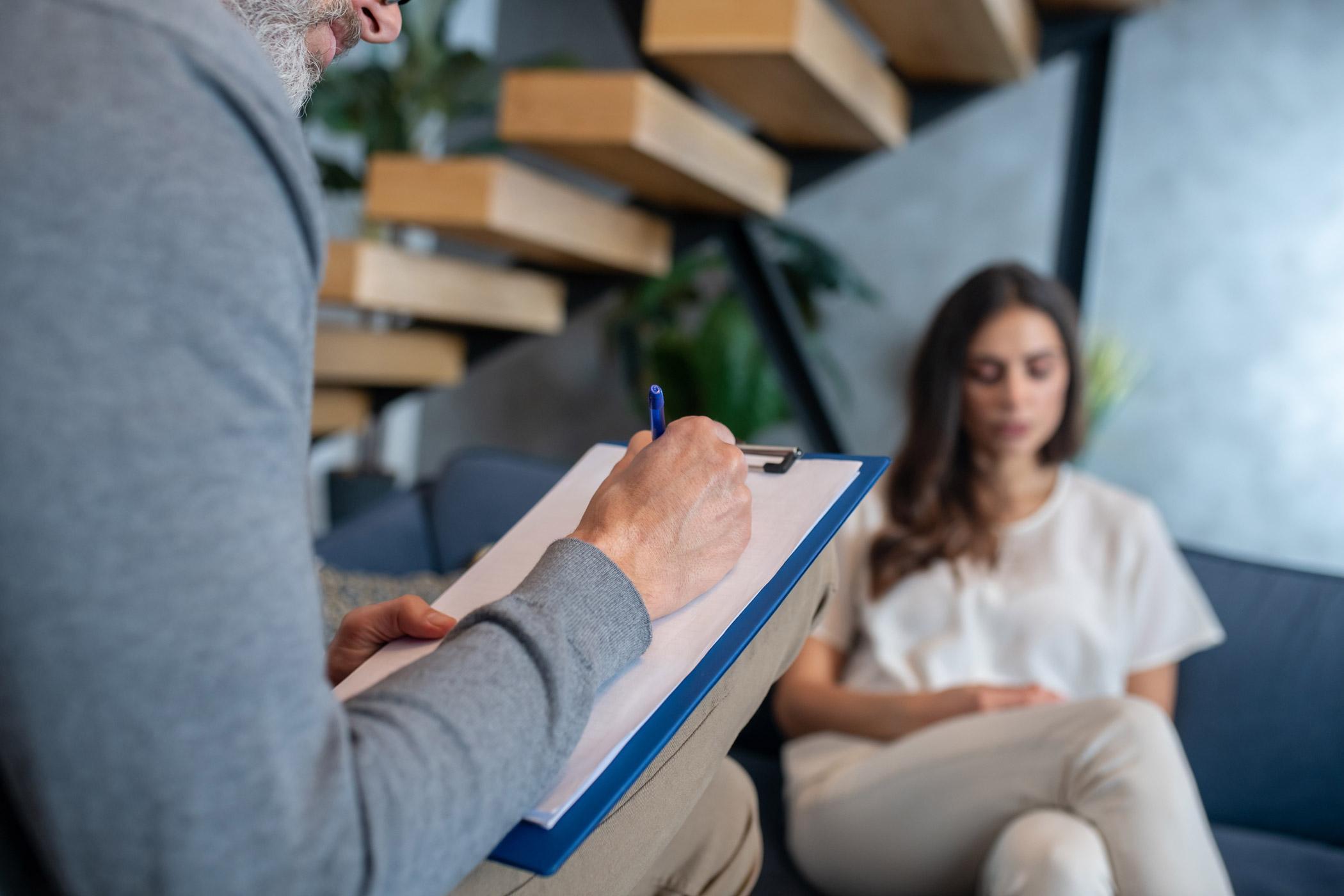 Psychology researcher conducting an interview study, representing advanced research methods and psychological investigation for Psychology MRes.
