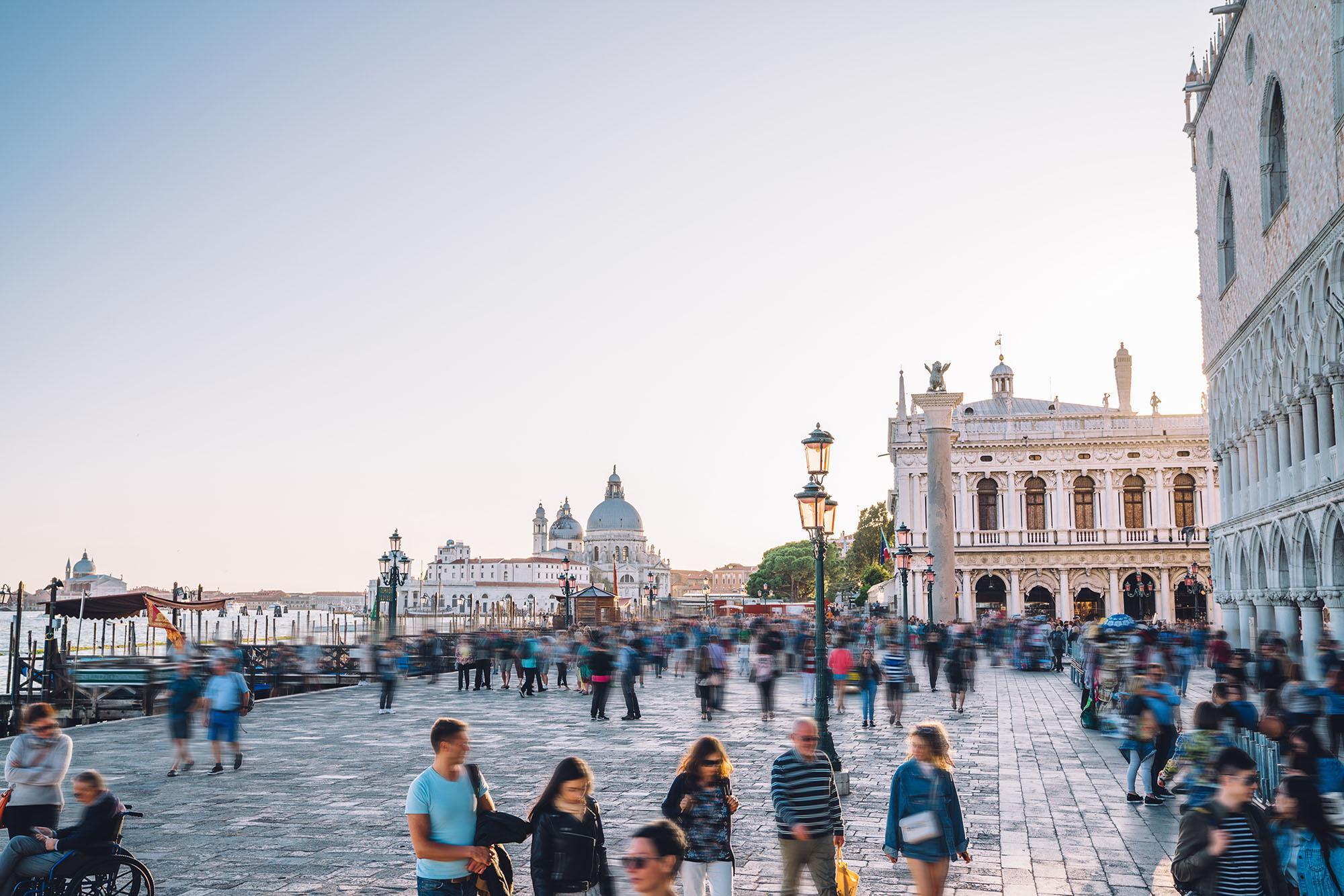 Tourists and students in St. Mark’s Square, Venice, representing global travel, cultural exchange, and international career opportunities offered through a university International Tourism Management BA (Hons) degree program.
