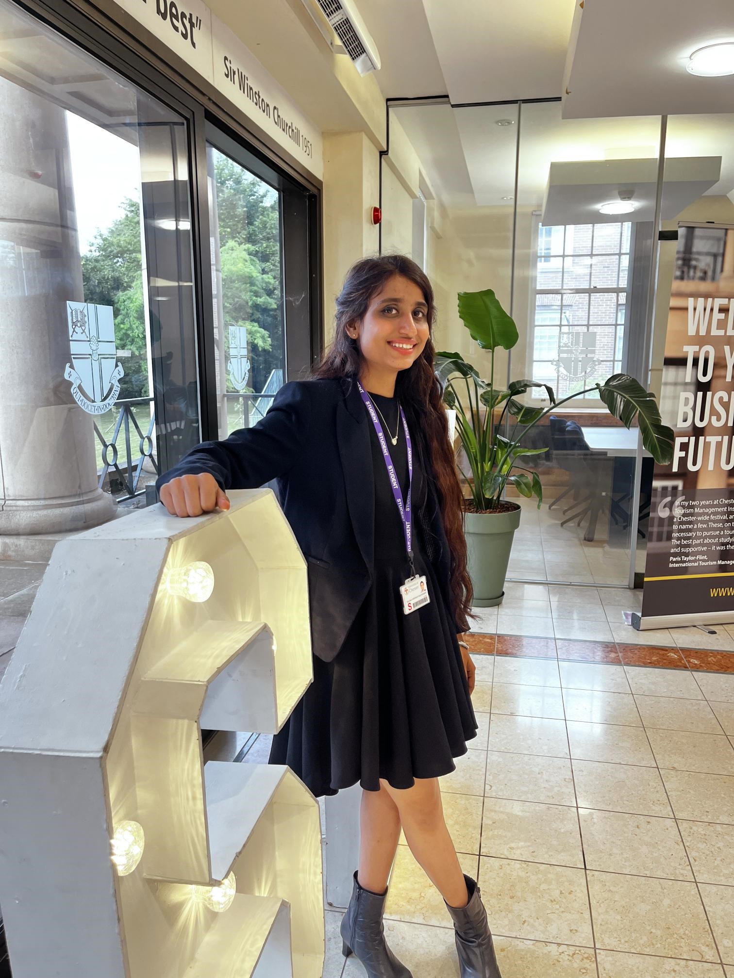 Student standing inside Churchill House